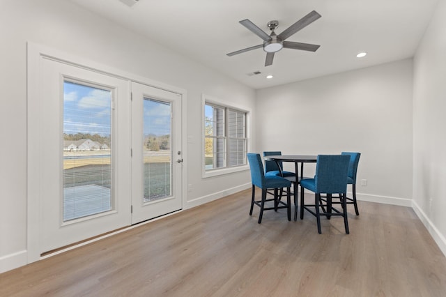 dining room featuring light hardwood / wood-style flooring and ceiling fan