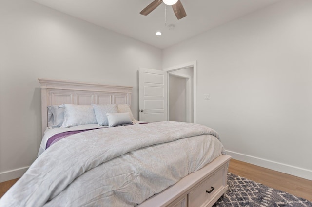 bedroom with hardwood / wood-style flooring and ceiling fan