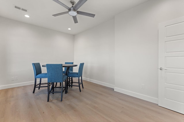 dining room featuring ceiling fan and light hardwood / wood-style floors