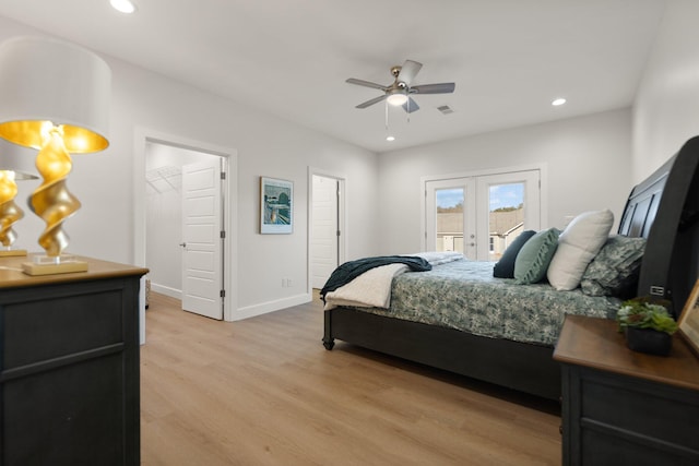 bedroom with access to exterior, light hardwood / wood-style floors, french doors, and ceiling fan