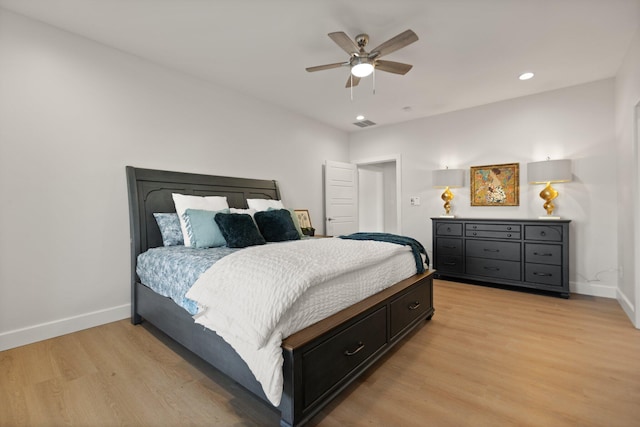 bedroom featuring light hardwood / wood-style floors and ceiling fan