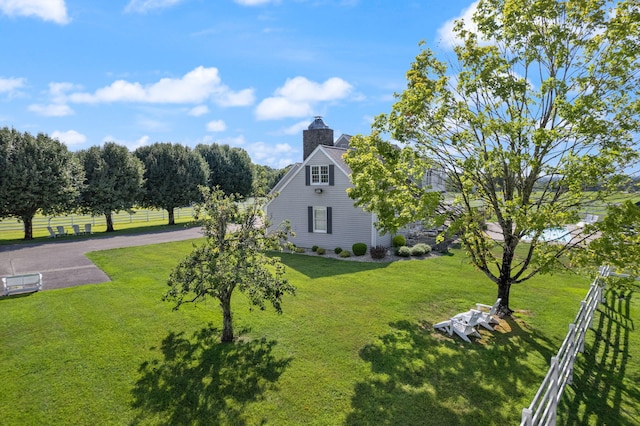 view of home's exterior with a lawn