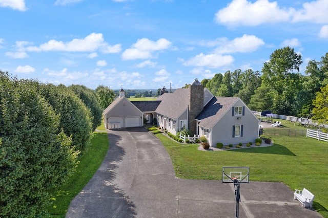 view of front of home featuring a garage and a front lawn