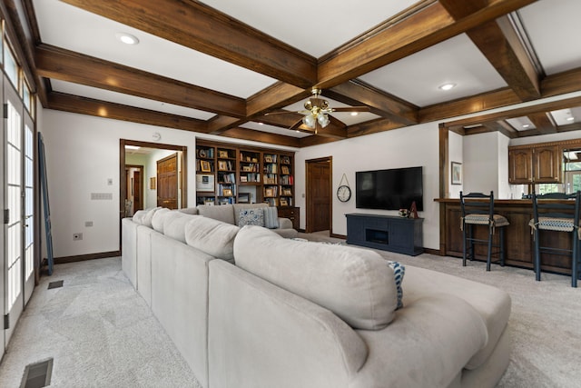 carpeted living room featuring ceiling fan, beamed ceiling, and coffered ceiling