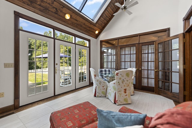 living area with light tile patterned flooring, ceiling fan, wooden ceiling, french doors, and high vaulted ceiling