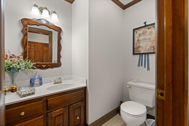 bathroom featuring tile patterned flooring, ornamental molding, vanity, and toilet