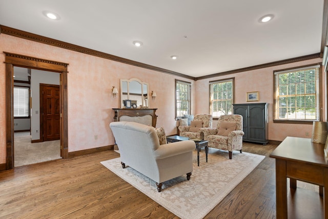 living room with crown molding and hardwood / wood-style flooring