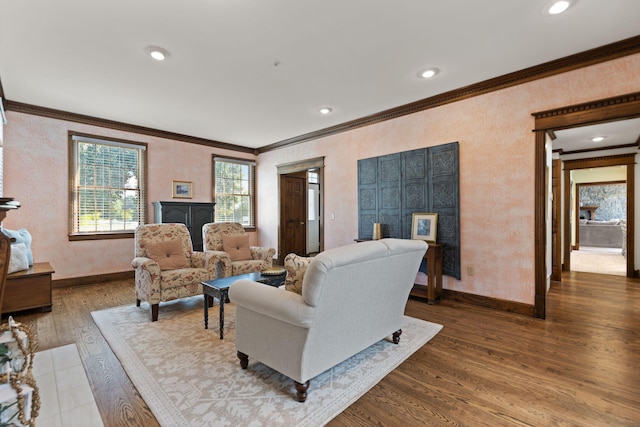 living room with hardwood / wood-style flooring and ornamental molding