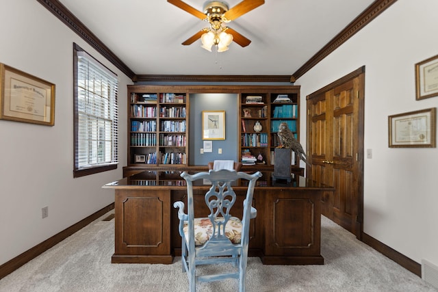 home office with crown molding, light colored carpet, and ceiling fan