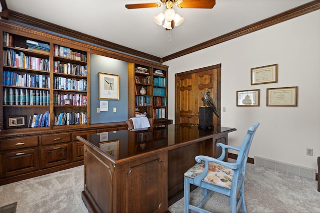 office space with light carpet, crown molding, and ceiling fan