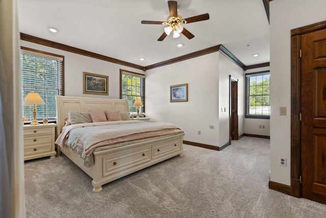 carpeted bedroom featuring ceiling fan, ornamental molding, and multiple windows