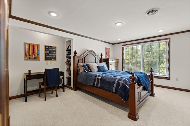 carpeted bedroom with ornamental molding