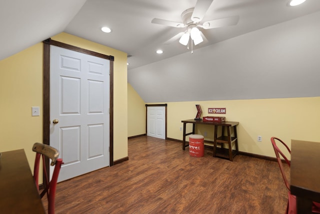 interior space featuring ceiling fan, lofted ceiling, and dark hardwood / wood-style floors