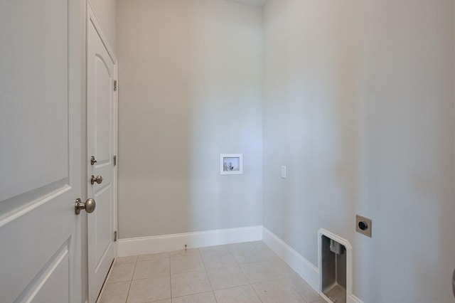 clothes washing area featuring electric dryer hookup, light tile floors, and hookup for a washing machine