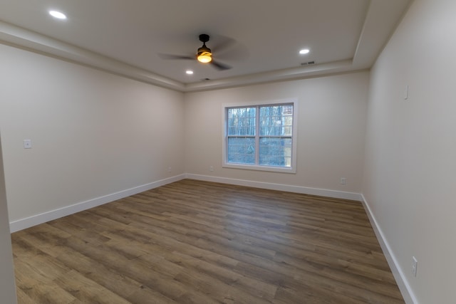 empty room with hardwood / wood-style flooring and ceiling fan