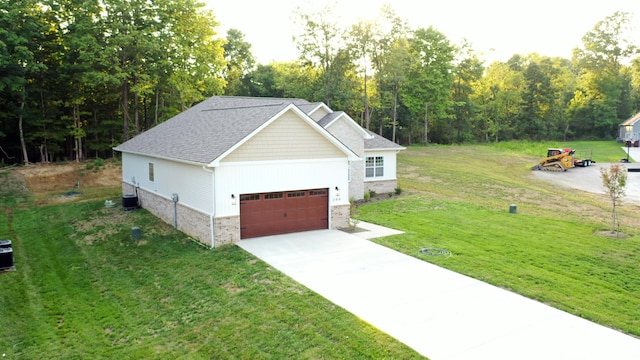 view of front facade with central AC unit, a front lawn, and a garage