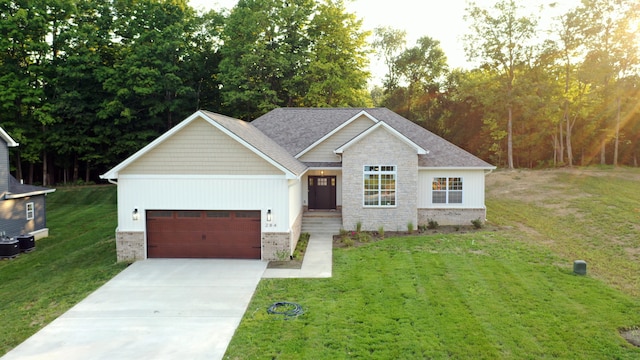 view of front of property with a garage and a front lawn