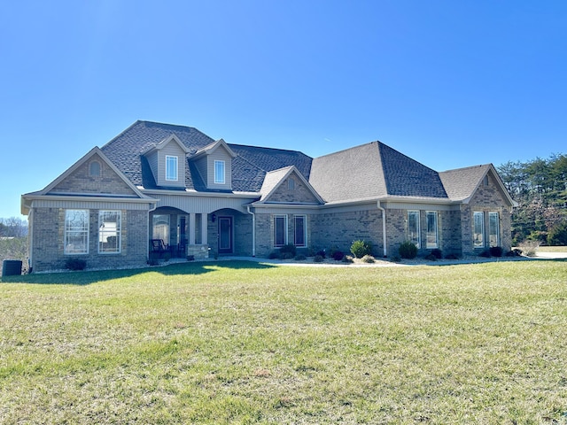 view of front of home featuring a front lawn and covered porch