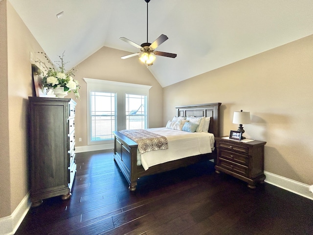 bedroom with dark wood-type flooring, ceiling fan, and vaulted ceiling