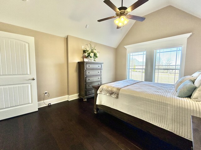 bedroom with ceiling fan, lofted ceiling, and dark hardwood / wood-style flooring