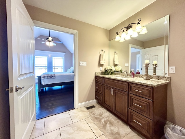 bathroom with vanity, lofted ceiling, and ceiling fan