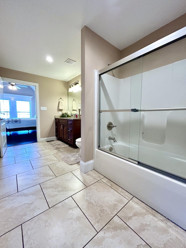 bathroom with vanity and enclosed tub / shower combo