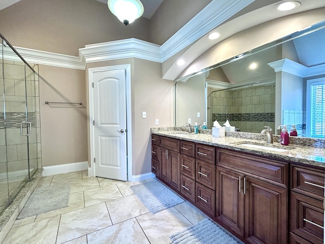 bathroom featuring vanity, lofted ceiling, and a shower with shower door