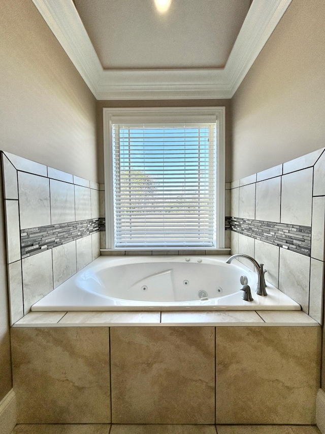 bathroom with ornamental molding, a wealth of natural light, and a relaxing tiled tub