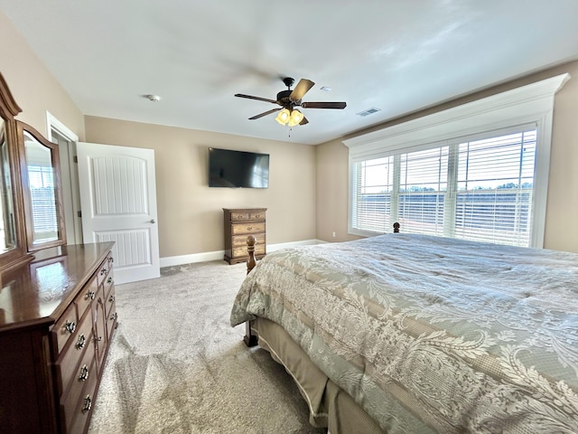 bedroom with light colored carpet and ceiling fan