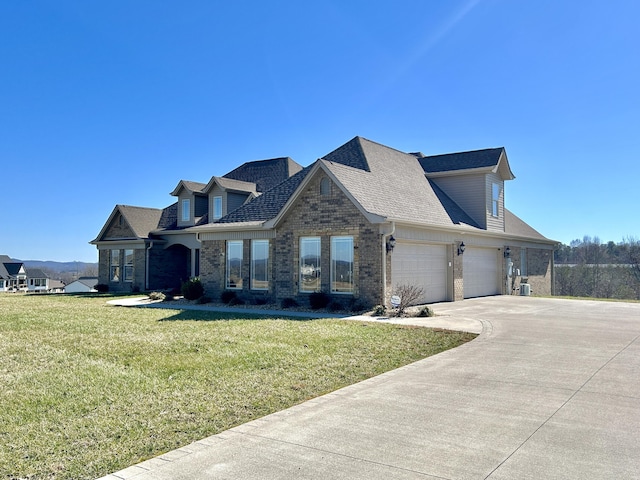 cape cod house featuring a garage and a front lawn