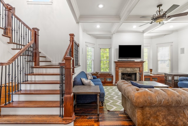 kitchen featuring built in appliances, a breakfast bar area, pendant lighting, light tile patterned floors, and ornamental molding