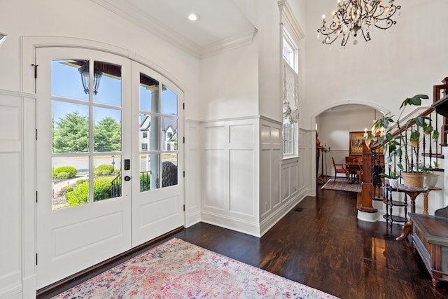 living room with crown molding and dark hardwood / wood-style flooring