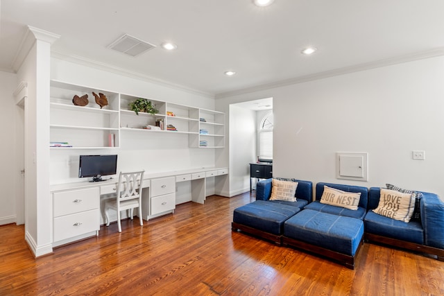 living room with crown molding and dark wood-type flooring