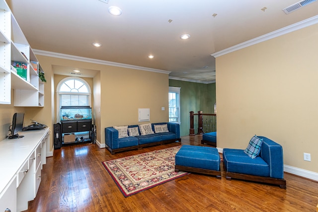 living room featuring crown molding, dark wood-type flooring, and a notable chandelier