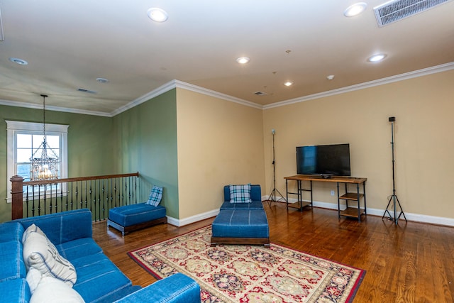 home office featuring built in desk, dark hardwood / wood-style floors, and ornamental molding