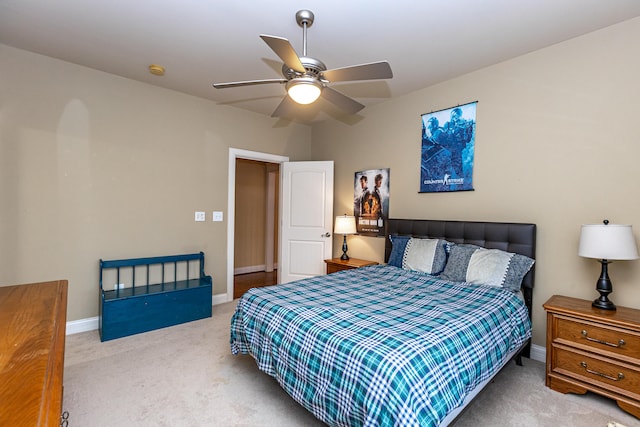 bedroom with light colored carpet and ceiling fan