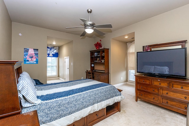 carpeted bedroom with ceiling fan