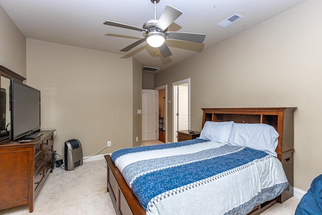 carpeted bedroom featuring ensuite bath and ceiling fan