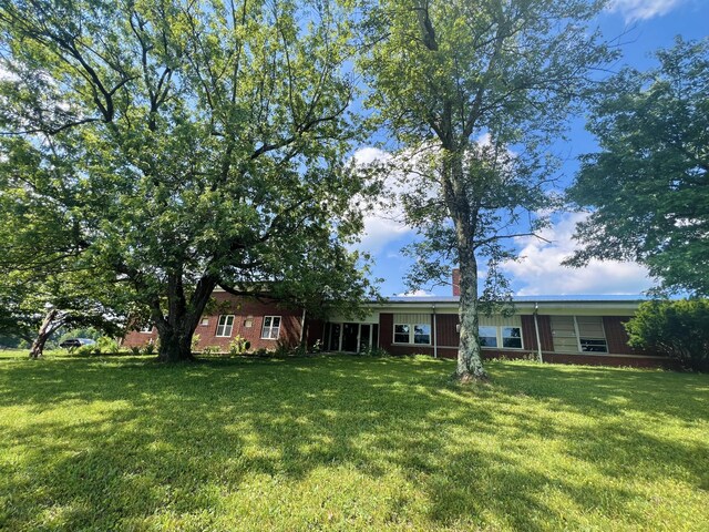 view of front of home with a front yard