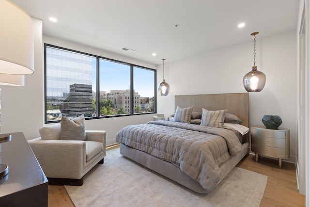 bedroom with light hardwood / wood-style flooring