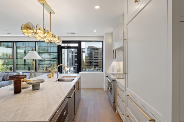 kitchen featuring light hardwood / wood-style flooring, sink, light stone countertops, electric range, and white cabinets