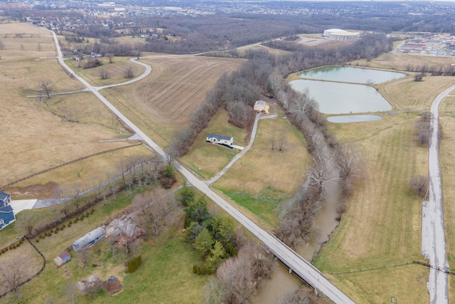 birds eye view of property with a rural view and a water view