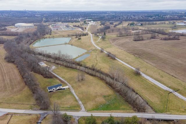 drone / aerial view with a rural view and a water view