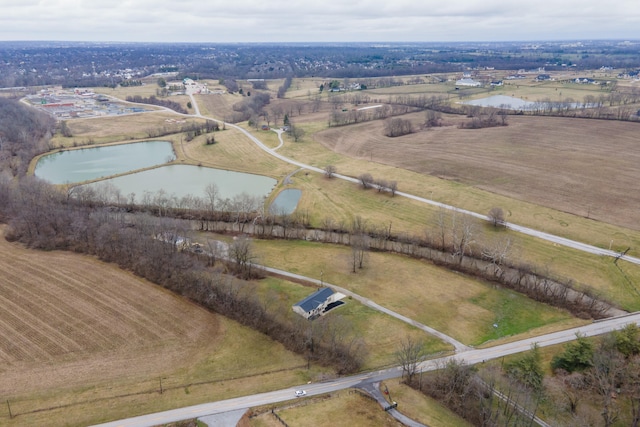 aerial view featuring a rural view and a water view