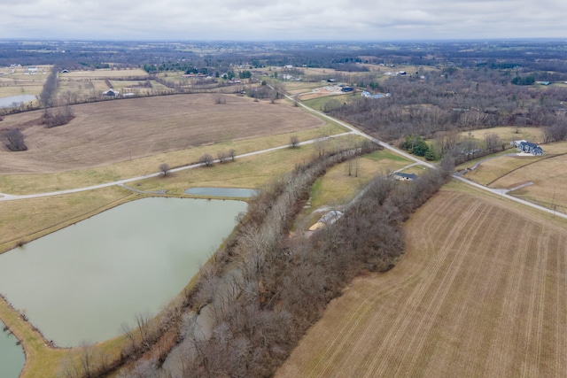 birds eye view of property featuring a rural view and a water view