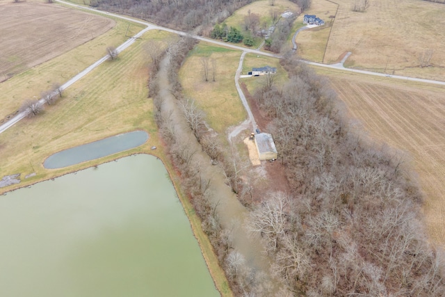 birds eye view of property featuring a rural view and a water view