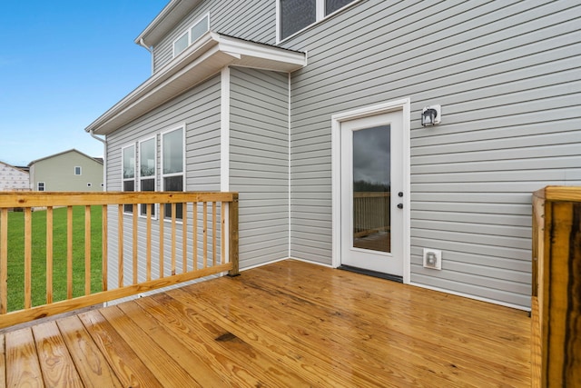 wooden terrace with a yard