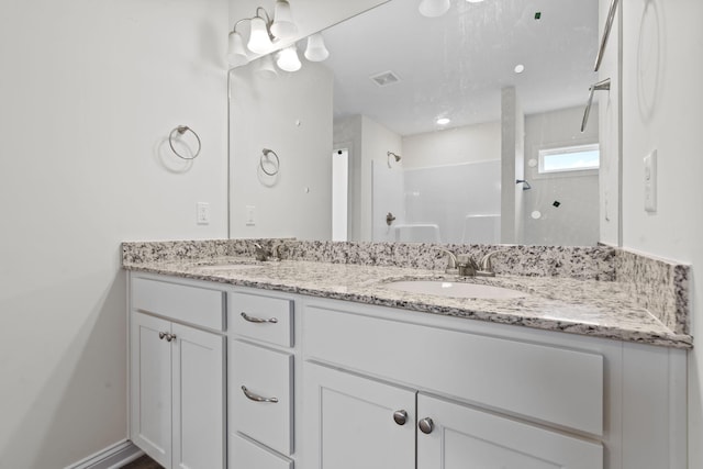 bathroom featuring vanity and walk in shower