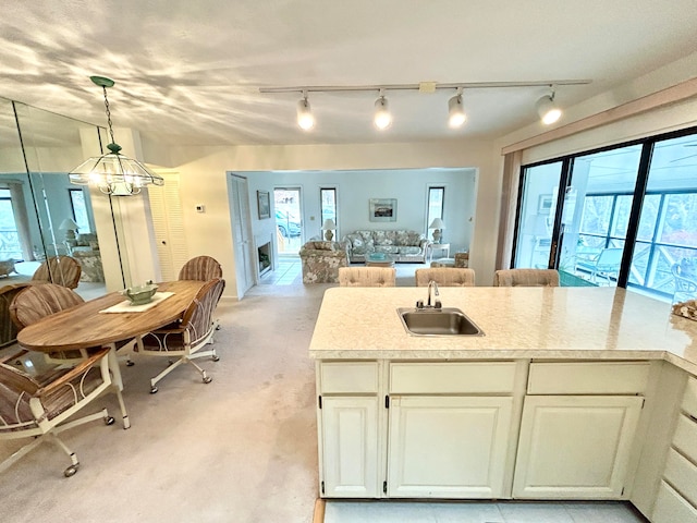 46-1 Woodson Bend Resort, Bronston, KY 42518 - kitchen featuring pendant lighting, a sink, white cabinetry, light countertops, and a chandelier