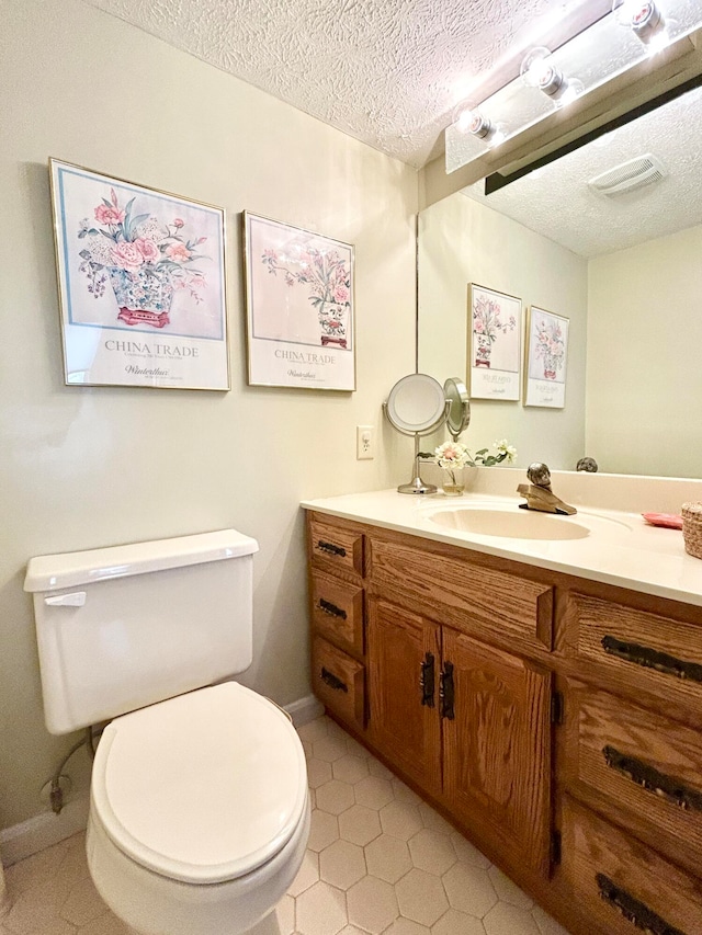 46-1 Woodson Bend Resort, Bronston, KY 42518 - bathroom with baseboards, toilet, vanity, and a textured ceiling
